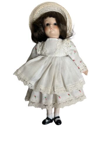 Vintage Doll. Porcelain head, arms, legs. Cloth Body. 8"