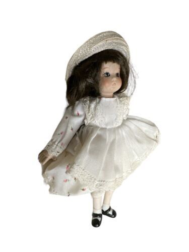 Vintage Doll. Porcelain head, arms, legs. Cloth Body. 8"