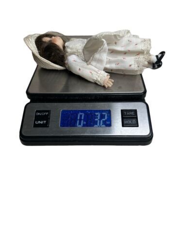 Vintage Doll. Porcelain head, arms, legs. Cloth Body. 8"