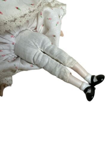 Vintage Doll. Porcelain head, arms, legs. Cloth Body. 8"