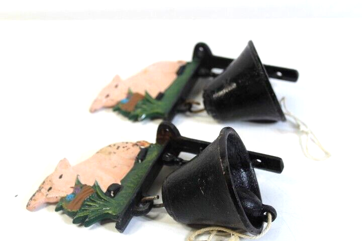 Set of 2 matching Cast Iron Pig design and wall hanging bells working