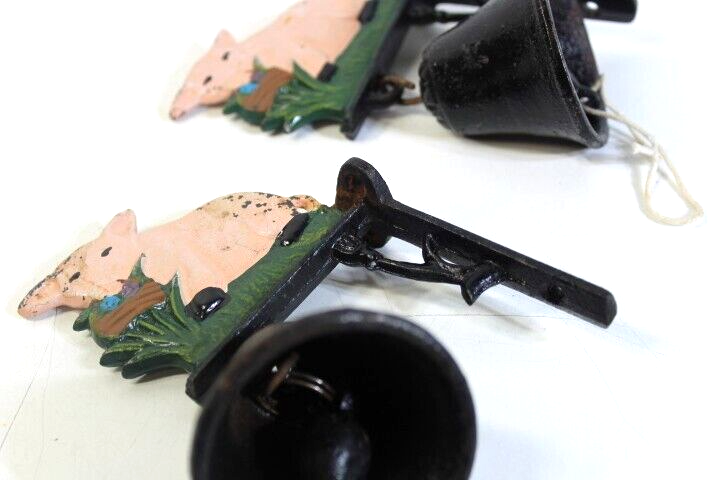 Set of 2 matching Cast Iron Pig design and wall hanging bells working